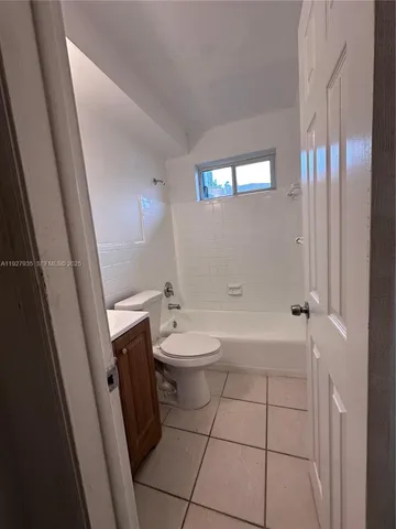 a bathroom with a bathtub a toilet a sink and a mirror