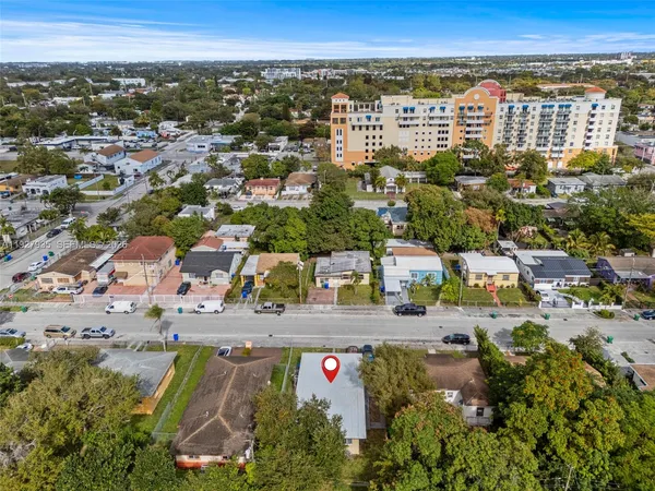 an aerial view of residential houses with outdoor space