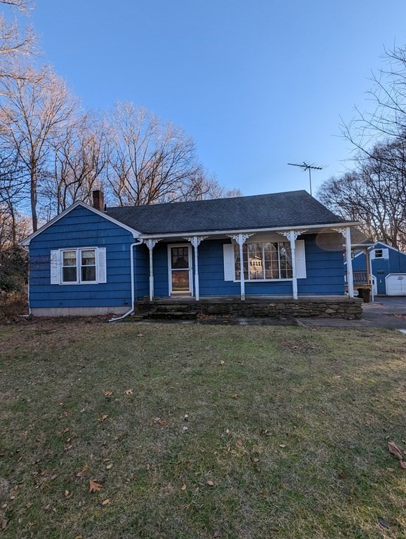 34 Colonial Road Sutton, MA 01590 - Photo 1 of 34 a front view of a house with garden