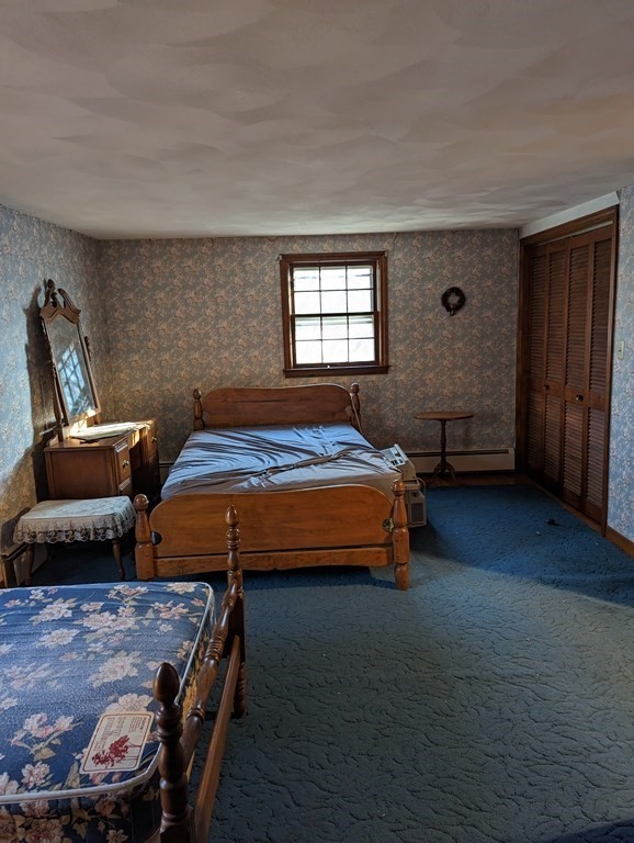 34 Colonial Road Sutton, MA 01590 - Photo 11 of 34 a bedroom with furniture and wooden floor