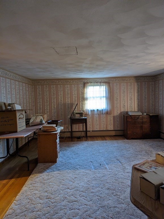 34 Colonial Road Sutton, MA 01590 - Photo 15 of 34 a living room with furniture window and a kitchen