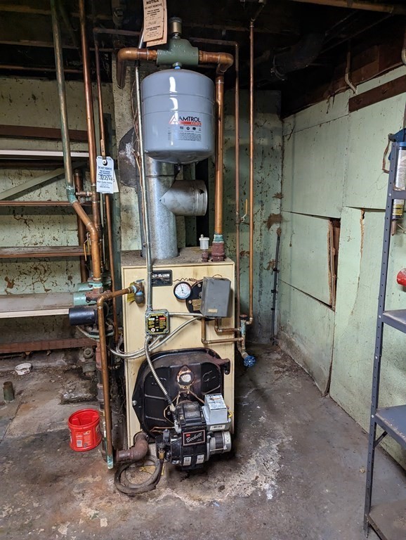 34 Colonial Road Sutton, MA 01590 - Photo 20 of 34 a storage room with washer and dryer