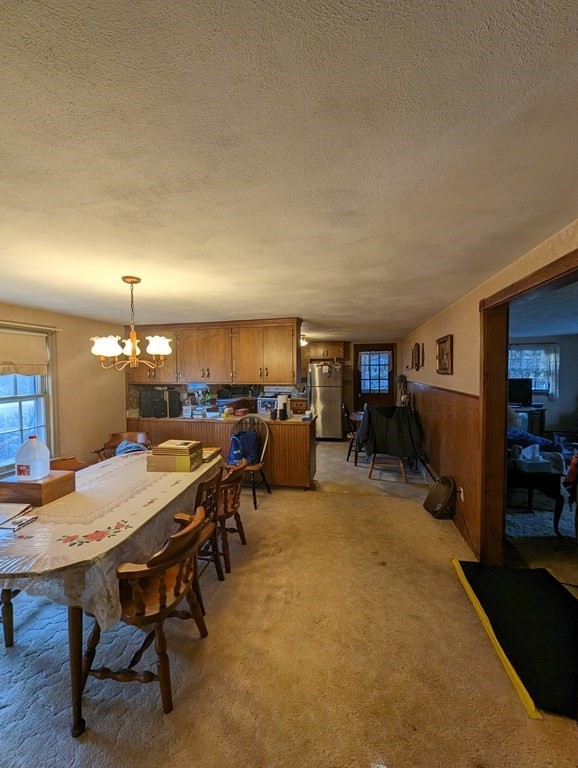 34 Colonial Road Sutton, MA 01590 - Photo 5 of 34 a view of a dining room with furniture