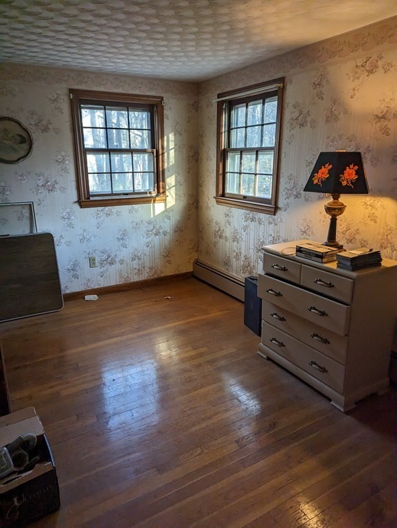 34 Colonial Road Sutton, MA 01590 - Photo 8 of 34 a view of a room with wooden floor and window