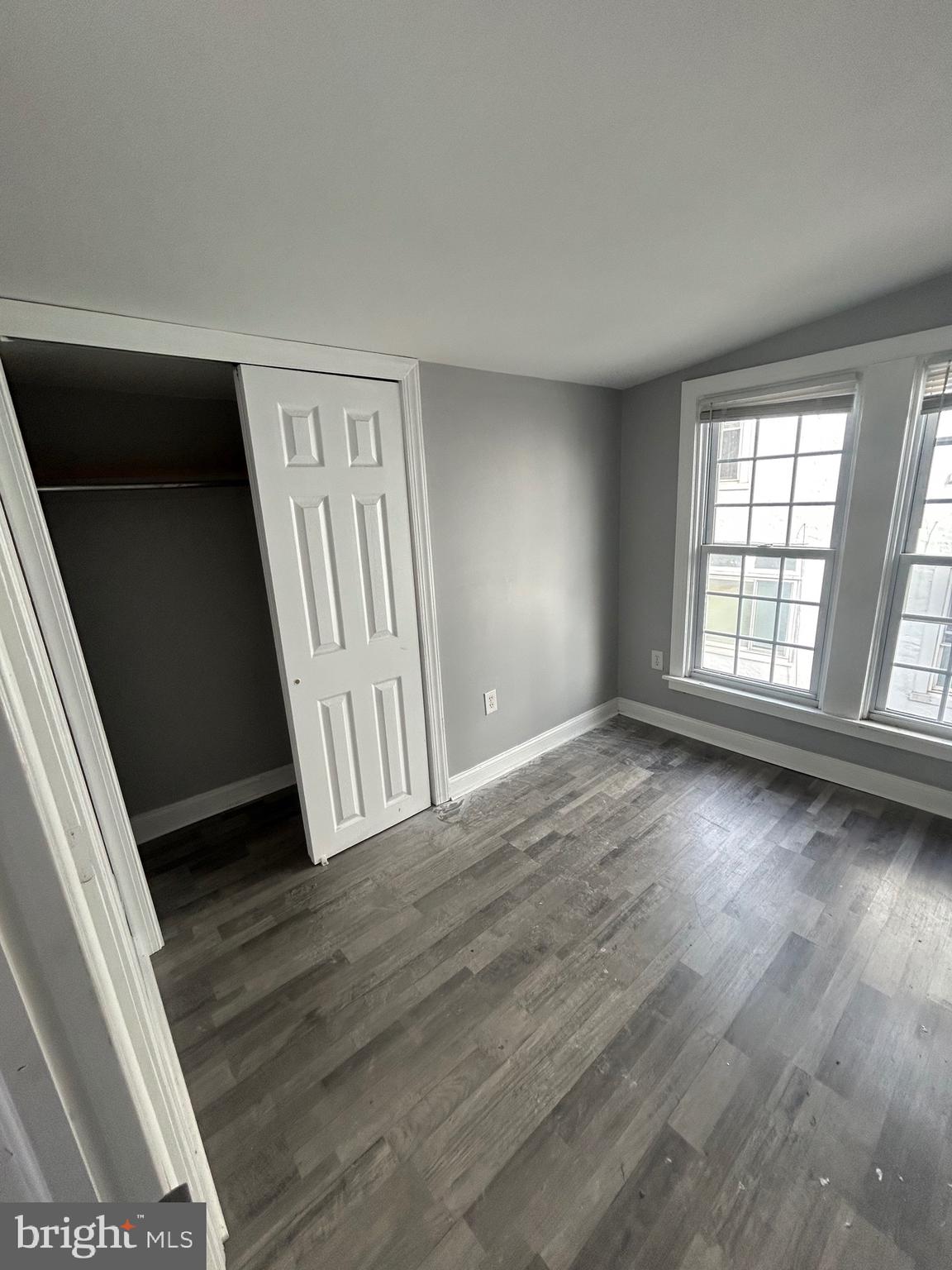 425 Main Street Royersford, PA 19468 - Photo 11 of 17 an empty room with wooden floor and windows