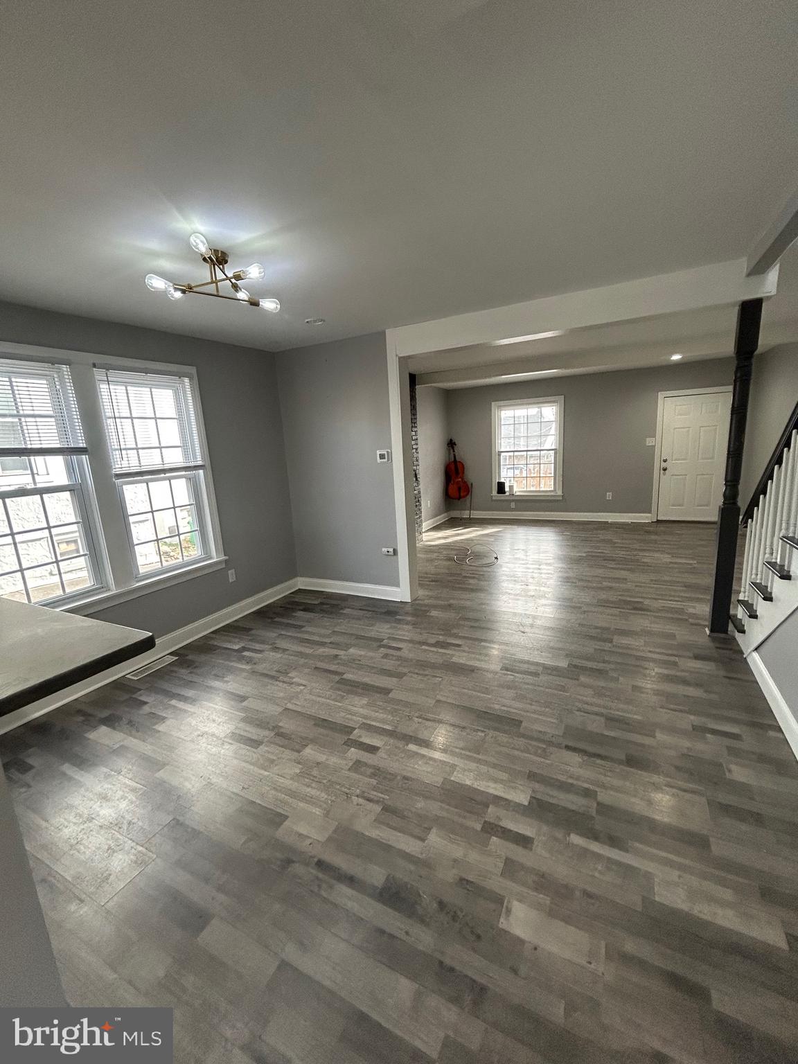 425 Main Street Royersford, PA 19468 - Photo 6 of 17 an empty room with wooden floor and windows