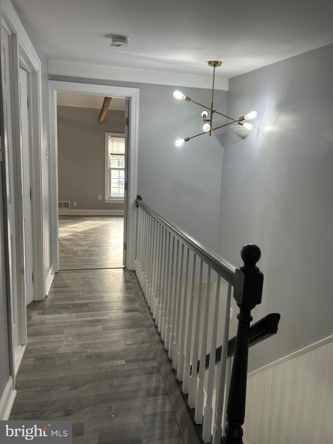 425 Main Street Royersford, PA 19468 - Photo 10 of 17 a view of a hallway with wooden floor and stairs