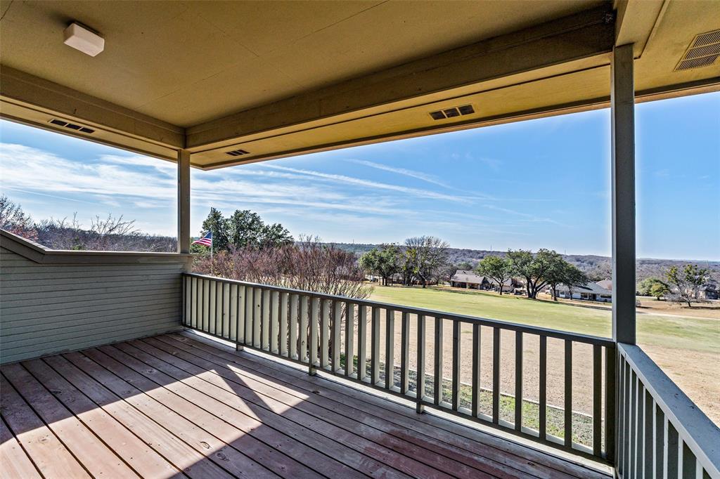 8908 Brierfield Road Granbury, TX 76049 - Photo 35 of 40 a view of balcony with wooden floor