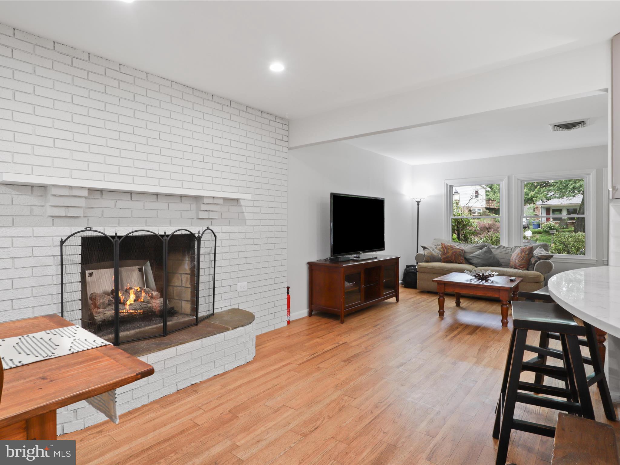 800 Williamsburg Road Sterling, VA 20164 - Photo 15 of 46 a living room with furniture a flat screen tv and a fireplace