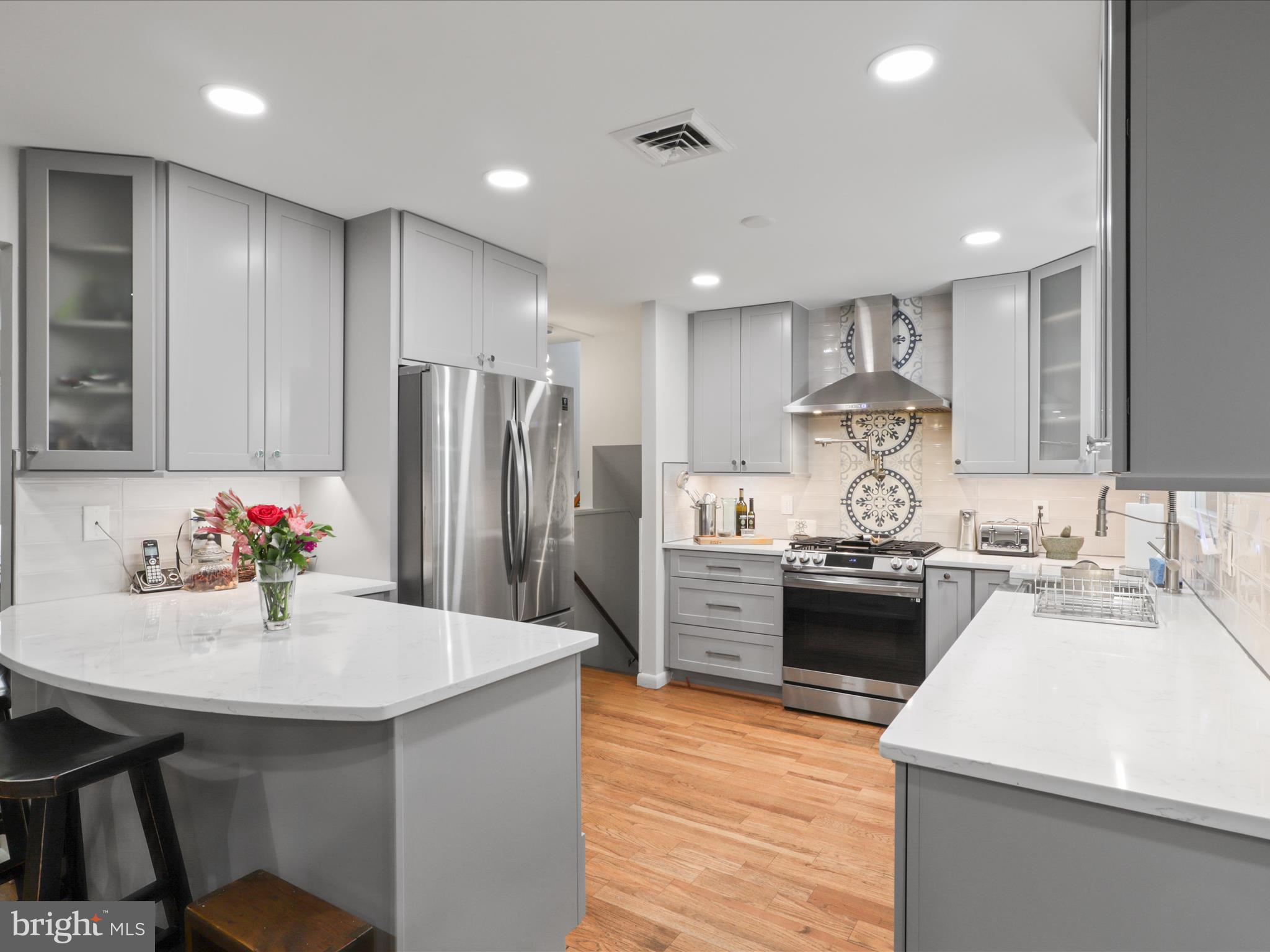 800 Williamsburg Road Sterling, VA 20164 - Photo 16 of 46 a kitchen with kitchen island a sink stove and refrigerator