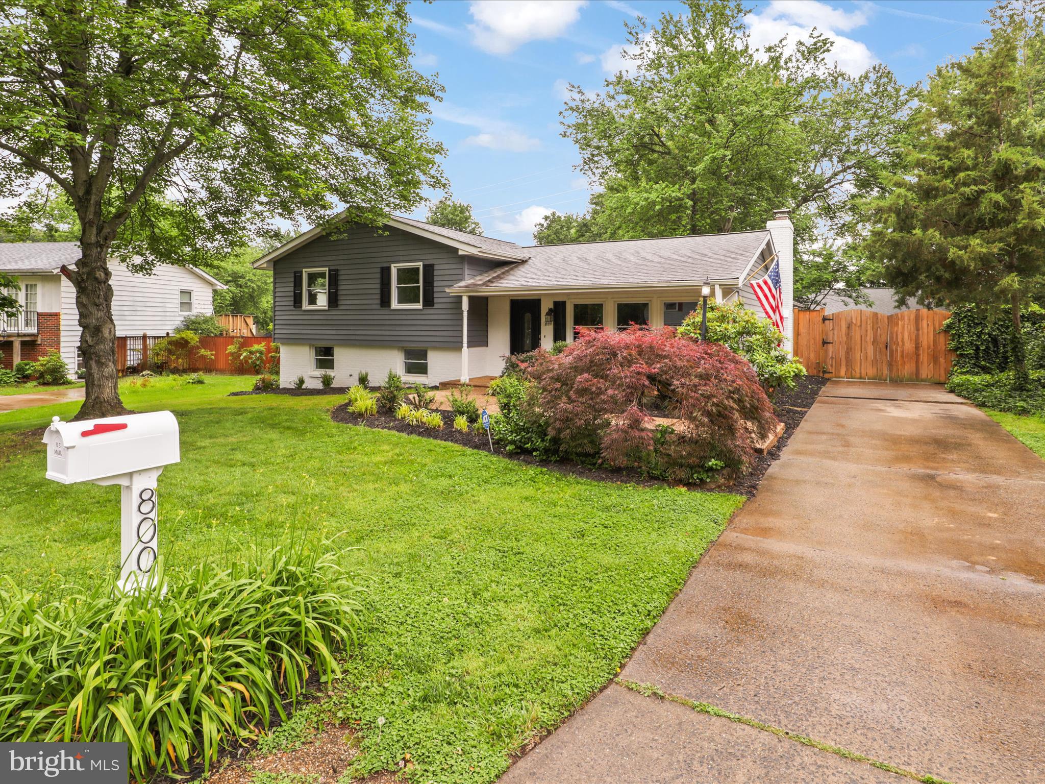 800 Williamsburg Road Sterling, VA 20164 - Photo 2 of 46 a front view of a house with a yard and trees