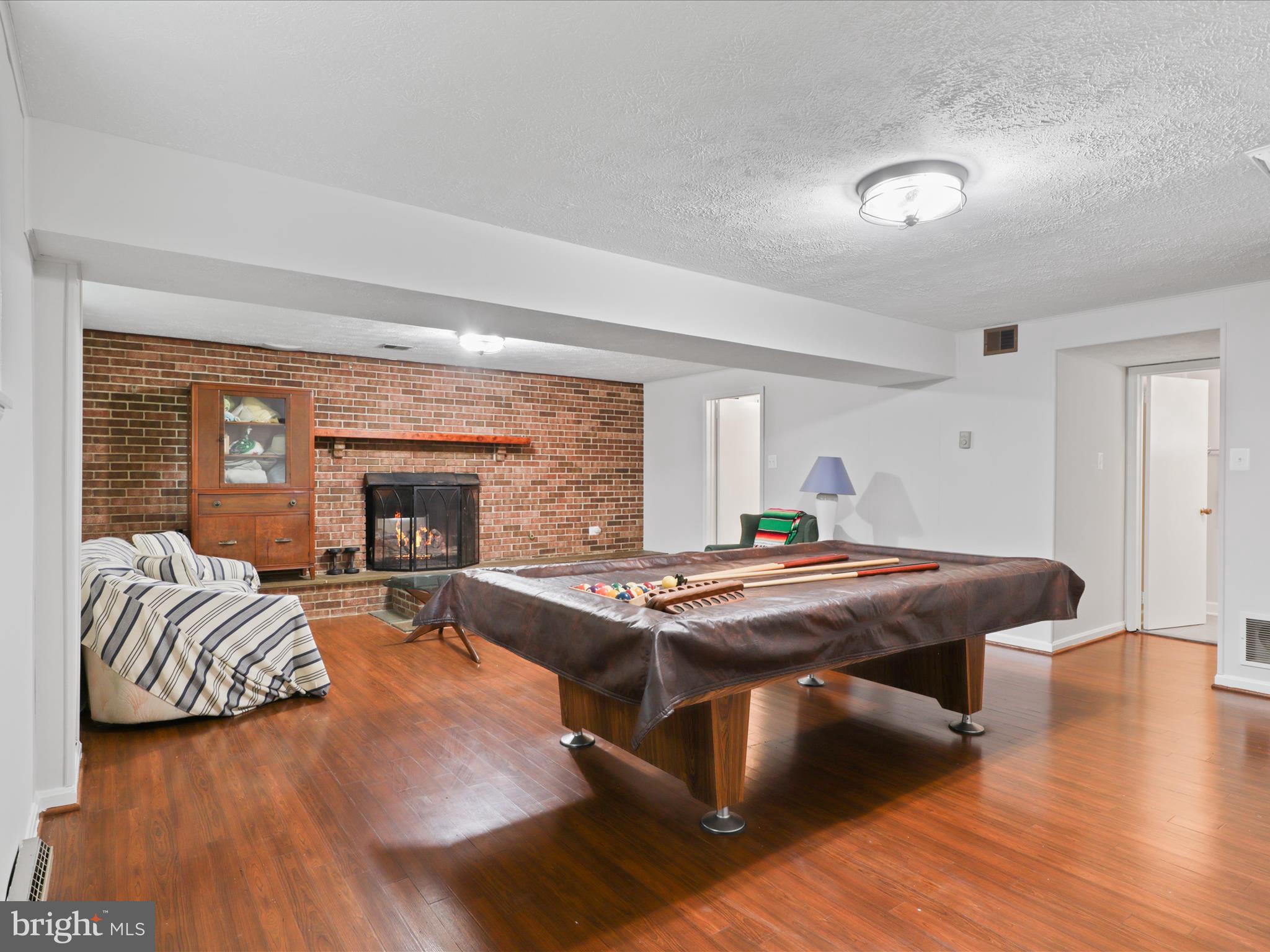 800 Williamsburg Road Sterling, VA 20164 - Photo 29 of 46 a room with furniture pool table wooden floor and windows
