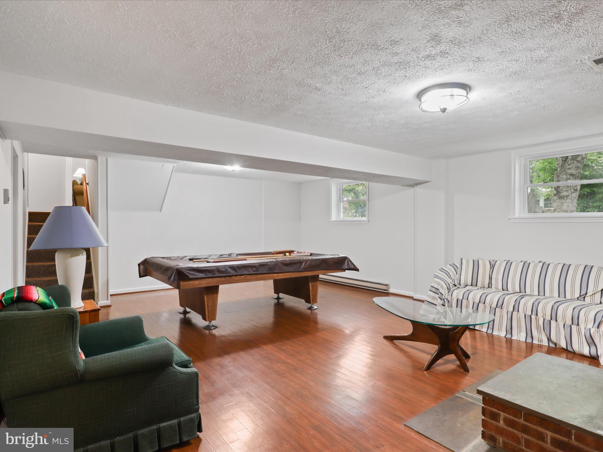 800 Williamsburg Road Sterling, VA 20164 - Photo 30 of 46 a living room with furniture a rug and a lamp