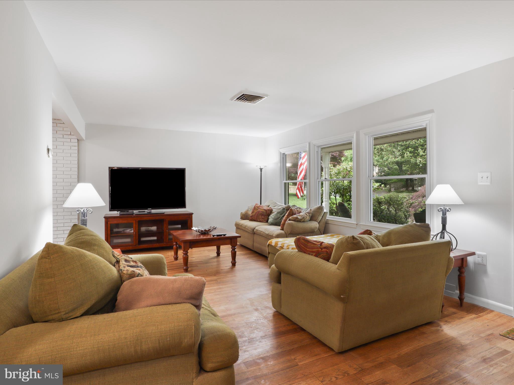 800 Williamsburg Road Sterling, VA 20164 - Photo 6 of 46 a living room with furniture and a flat screen tv