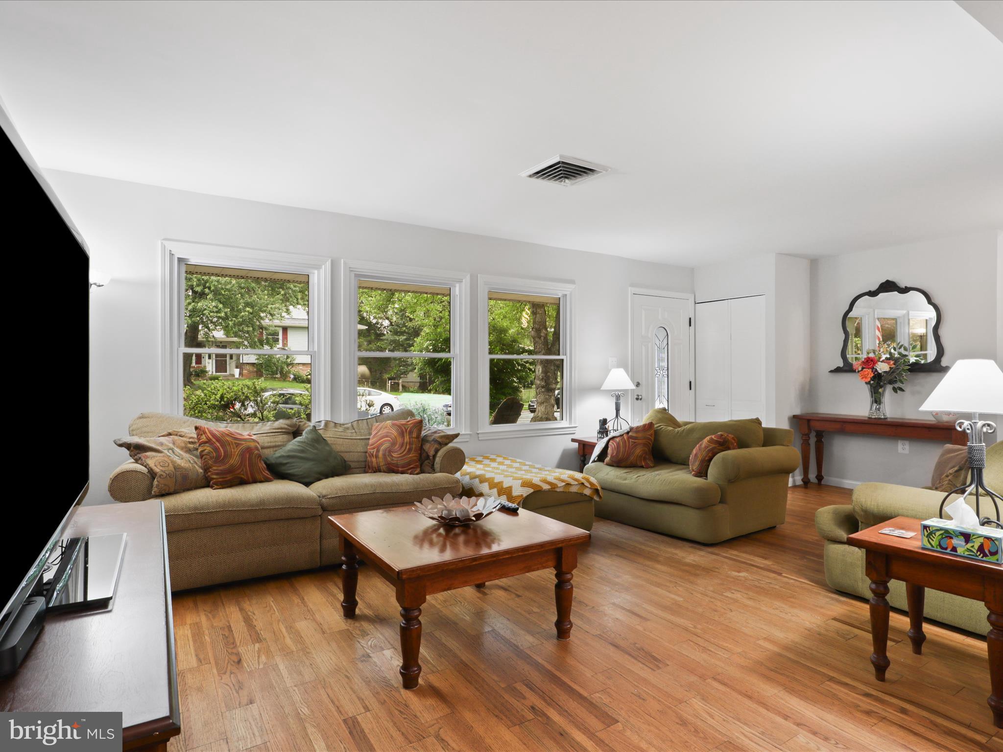 800 Williamsburg Road Sterling, VA 20164 - Photo 7 of 46 a living room with furniture and a flat screen tv