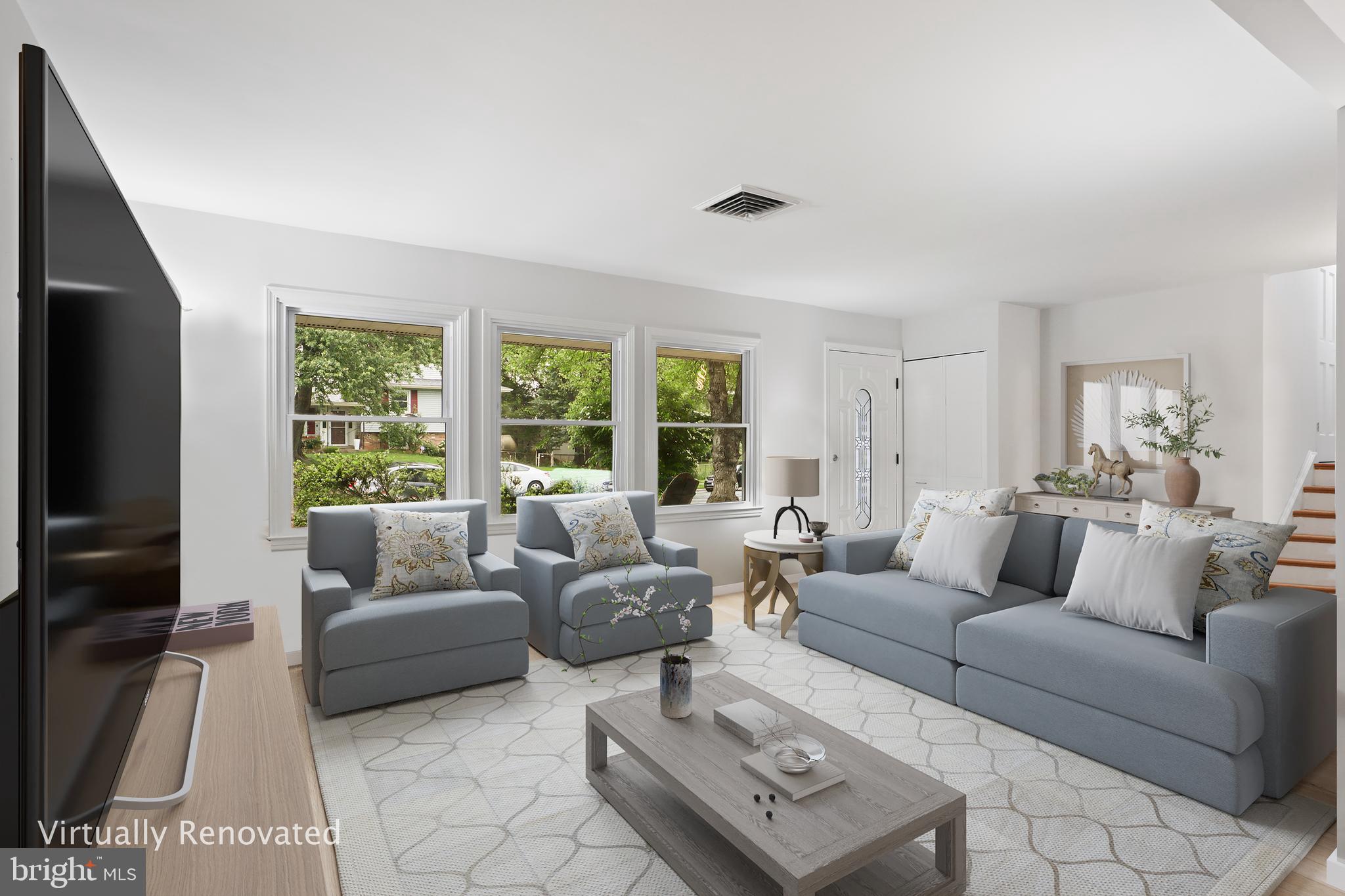 800 Williamsburg Road Sterling, VA 20164 - Photo 8 of 46 a living room with furniture a large window and a flat screen tv