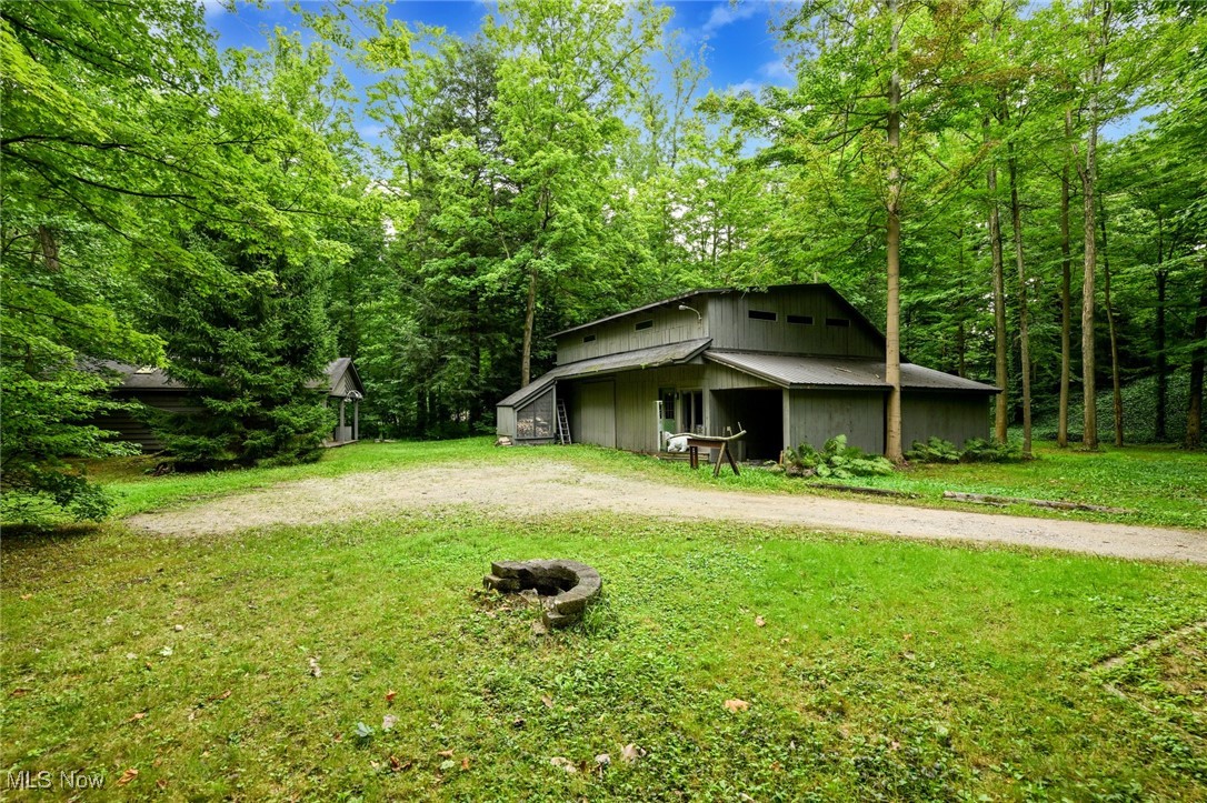 7061 Cascade Road Painesville, OH 44077 - Photo 37 of 49 View of yard featuring an outdoor structure