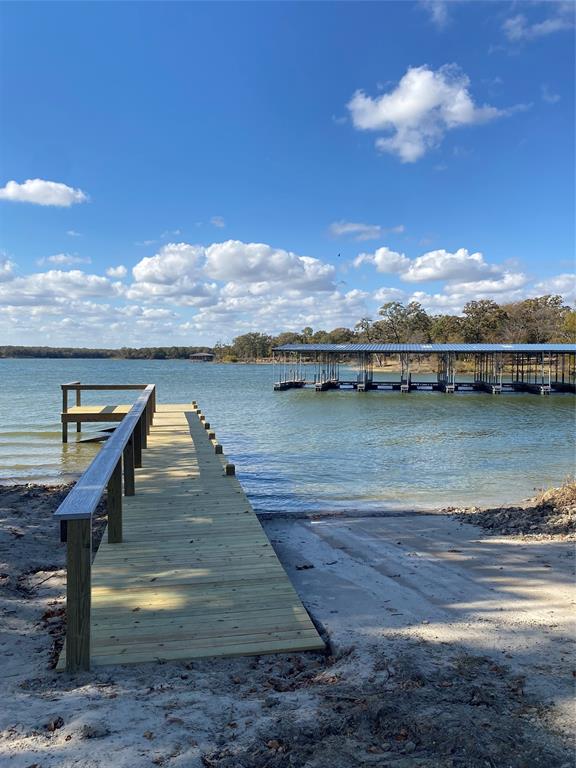 Tbd Nautical Drive Quinlan, TX 75474 - Photo 14 of 14 a view of a lake with houses in the back