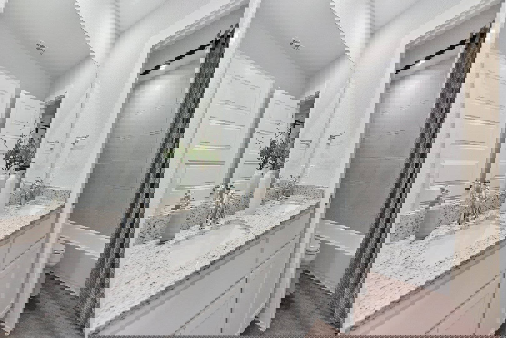 10601 Justify Lane Buda, TX 78610 - Photo 12 of 20 a bathroom with a granite countertop sink and a mirror