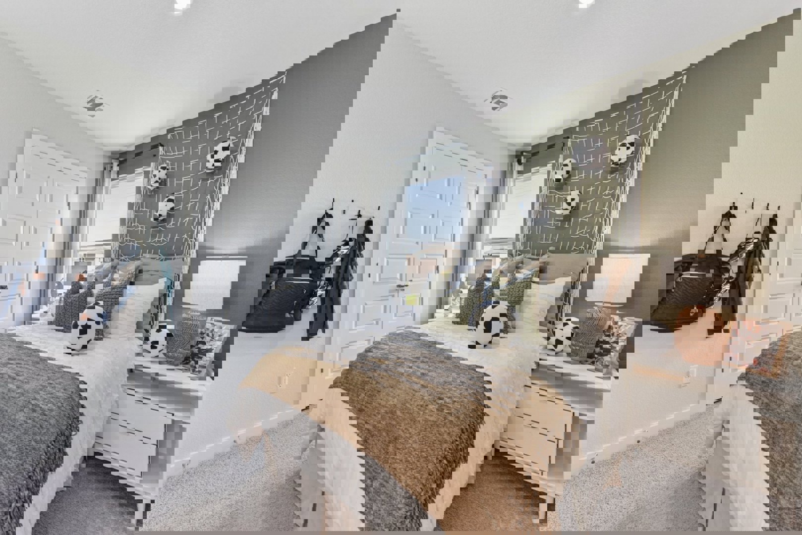 10601 Justify Lane Buda, TX 78610 - Photo 14 of 20 a bedroom with a bed and a dresser