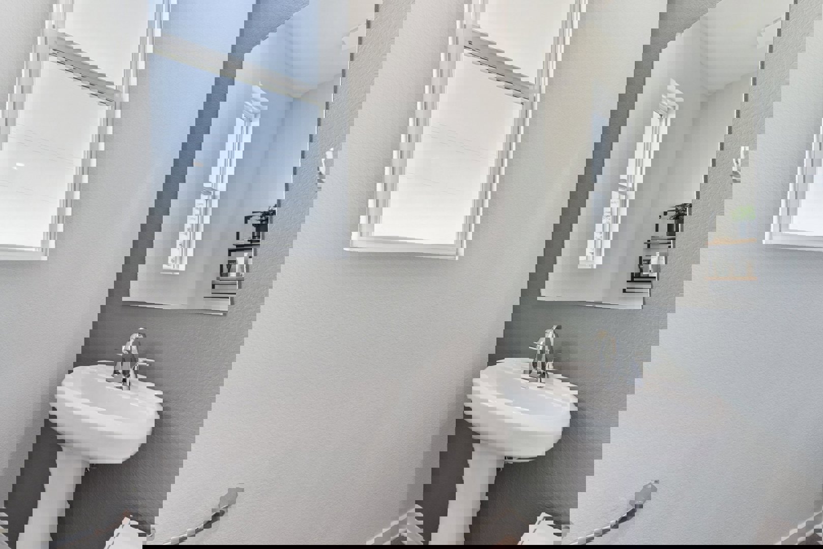 10601 Justify Lane Buda, TX 78610 - Photo 16 of 20 a bathroom with a sink a mirror and a window