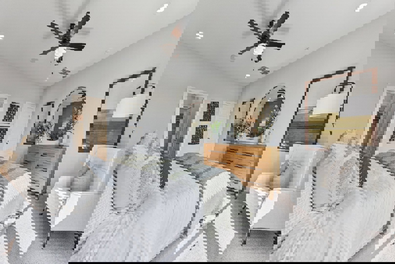 10601 Justify Lane Buda, TX 78610 - Photo 7 of 20 a bedroom with a large bed and ceiling fan