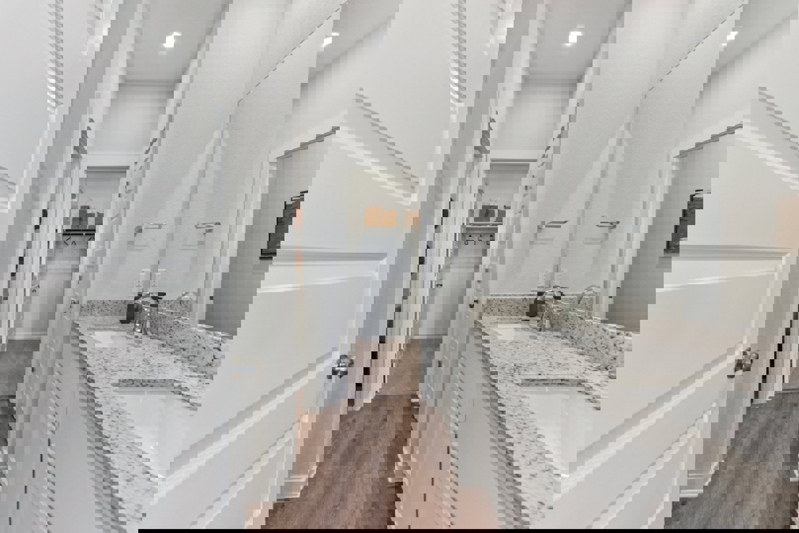 10601 Justify Lane Buda, TX 78610 - Photo 8 of 20 a bathroom with a granite countertop double vanity sink and mirror