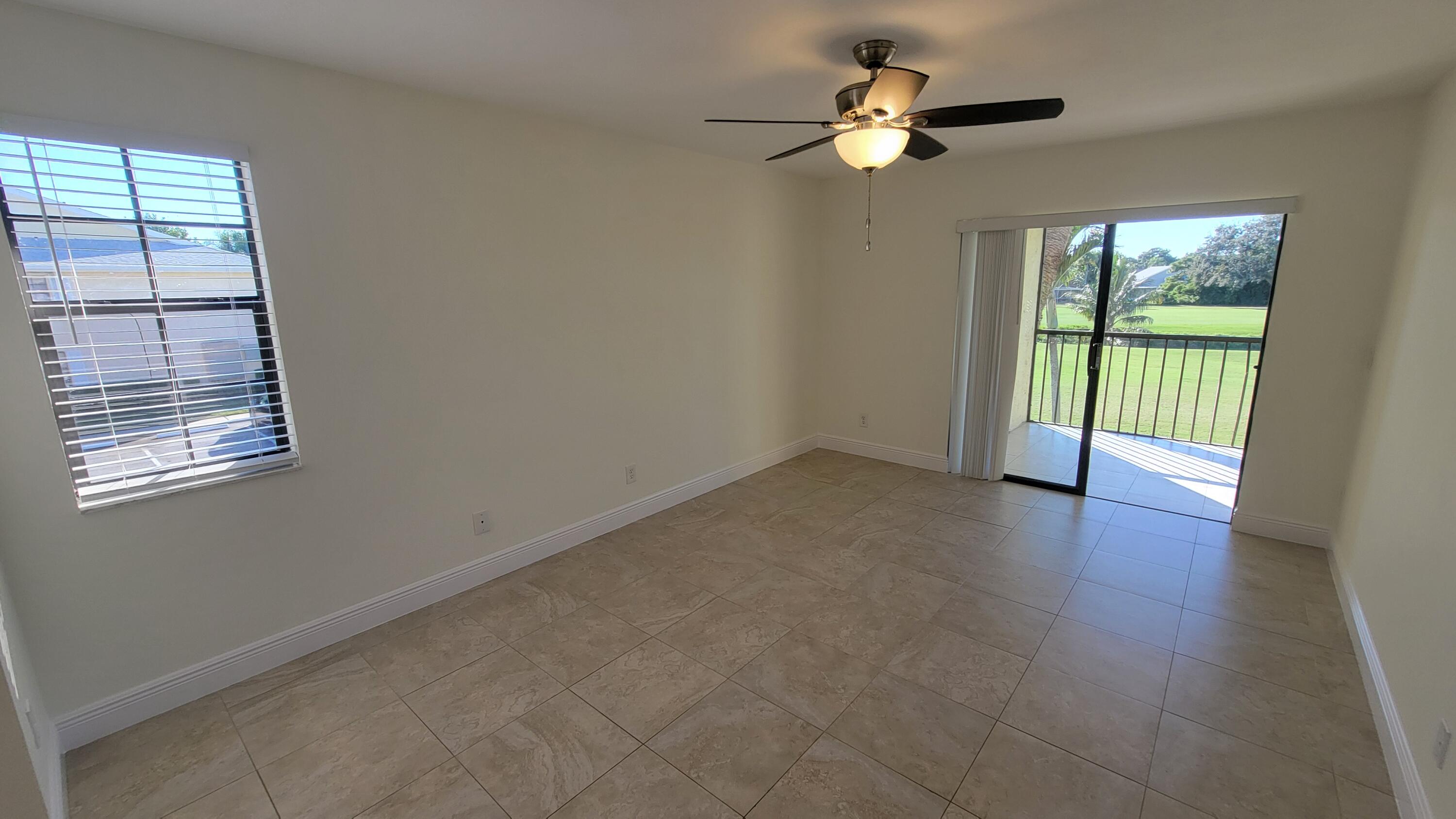 1072 Keystone Drive, Unit A Jupiter, FL 33458 - Photo 14 of 29 a view of an empty room with a window