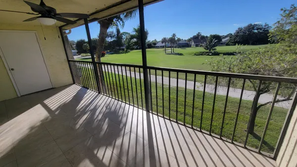 a view of balcony with wooden floor