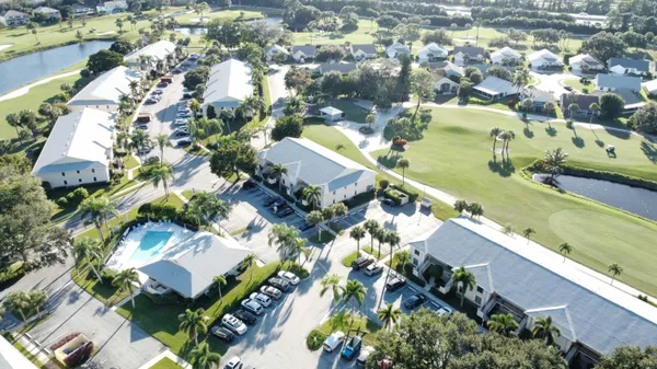 an aerial view of residential houses with outdoor space