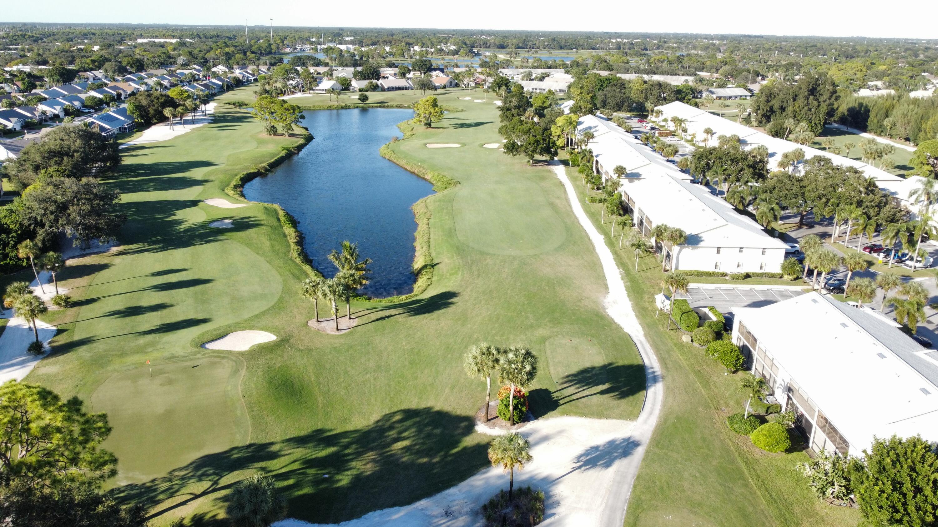 1072 Keystone Drive, Unit A Jupiter, FL 33458 - Photo 26 of 29 an aerial view of residential houses with outdoor space