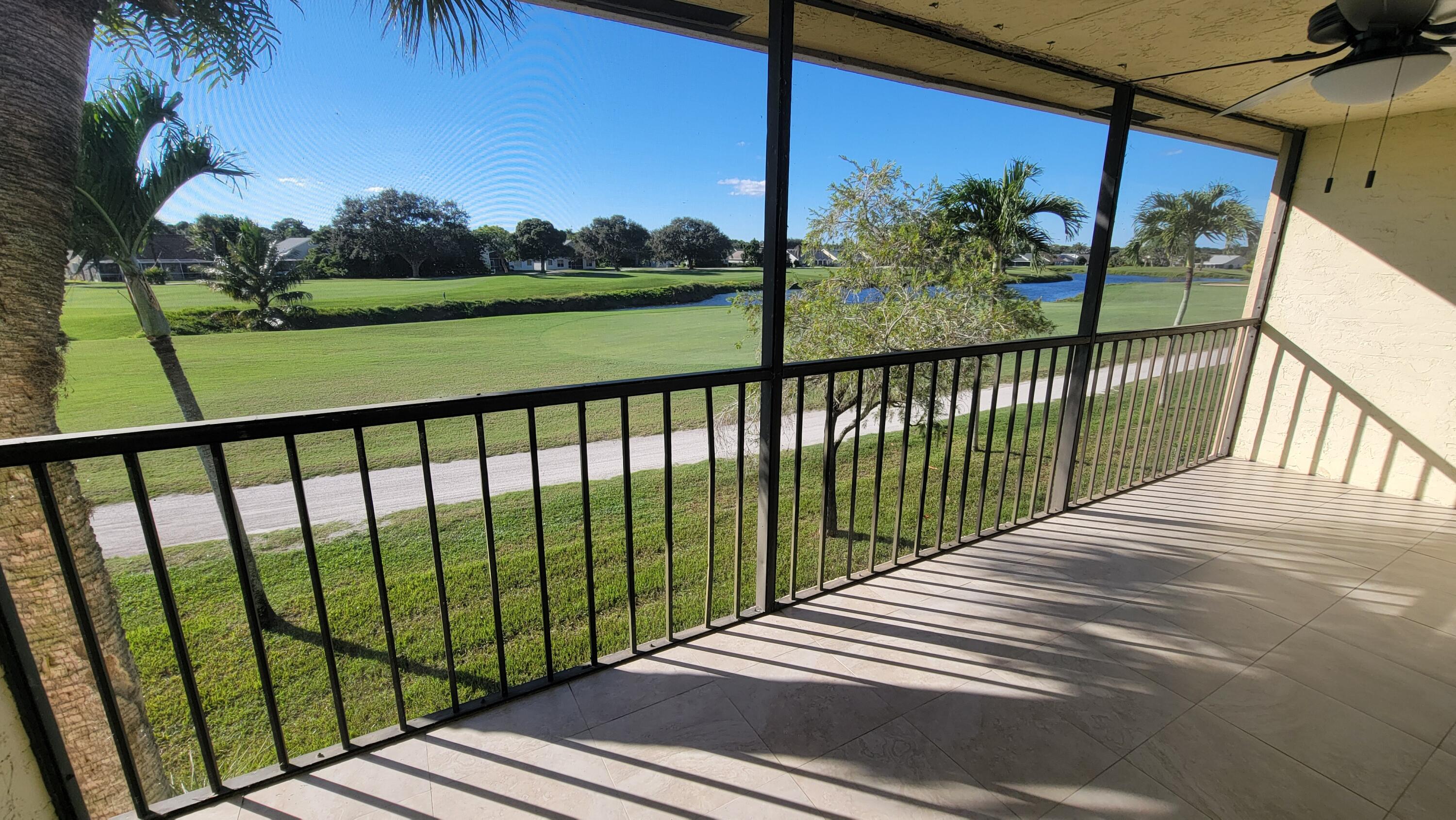 1072 Keystone Drive, Unit A Jupiter, FL 33458 - Photo 3 of 29 a view of a street from a balcony