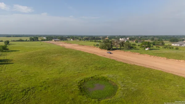 a view of a lake with a big yard