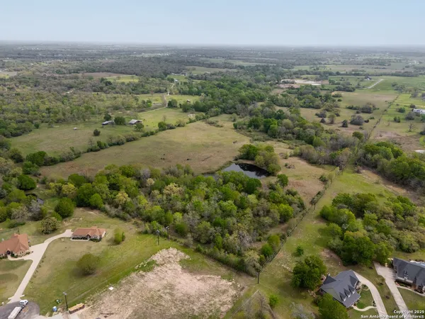 an aerial view of a houses with outdoor space