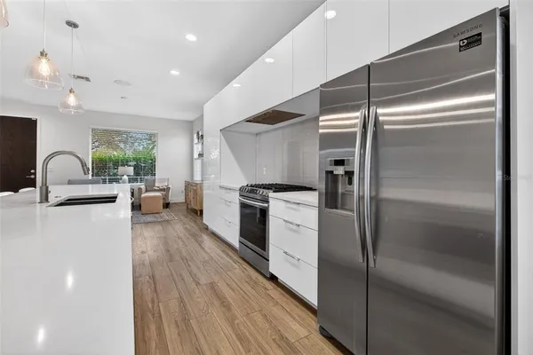 a kitchen with counter top space and stainless steel appliances