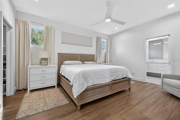 a bedroom with a bed and a dresser