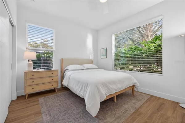a bed room with a bed and a window