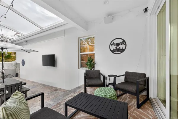 a living room with furniture and a window