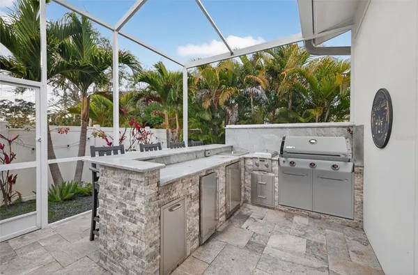a view of open kitchen with a sink and counter top space