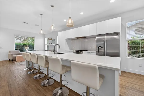 a kitchen with counter space cabinets and appliances