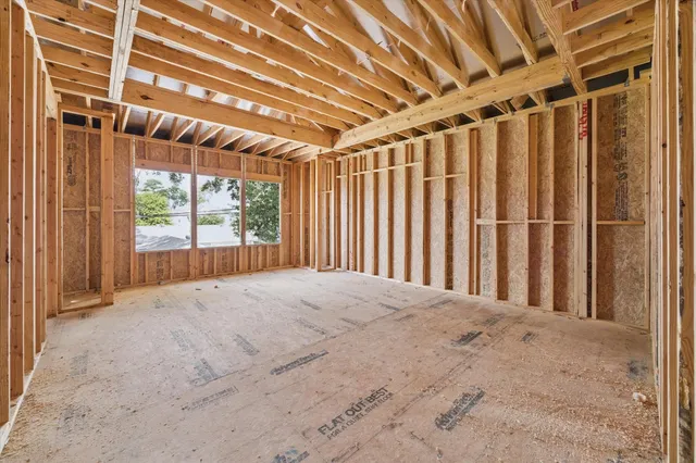 a view of a room with wooden walls