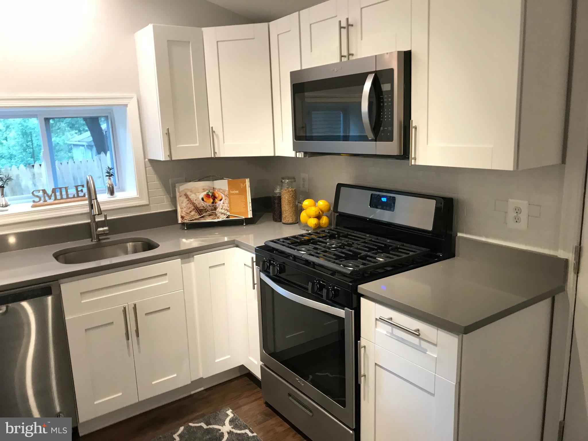 9326 Decatur Place Laurel, MD 20723 - Photo 13 of 26 New Stainless Steel Appliances, Quartz Counters