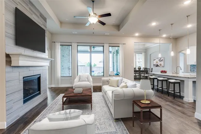 a living room with furniture fireplace and a flat screen tv