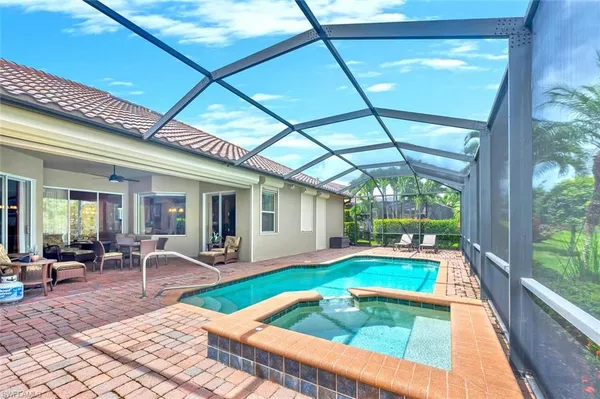 a view of a backyard with sitting area