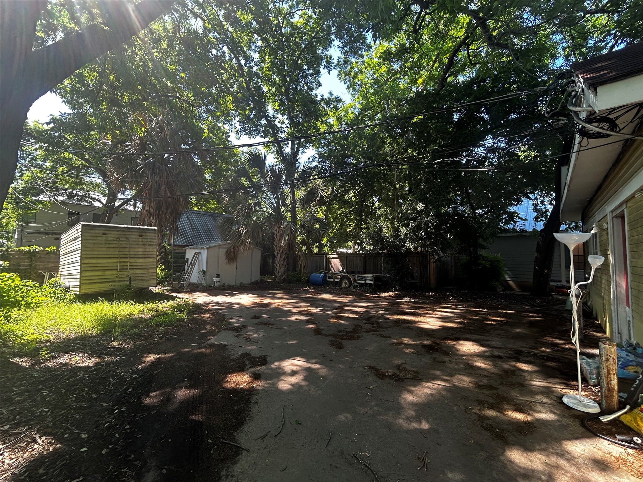 4511 B Avenue, Unit B Austin, TX 78751 - Photo 24 of 30 a backyard of a house with barbeque oven table and chairs