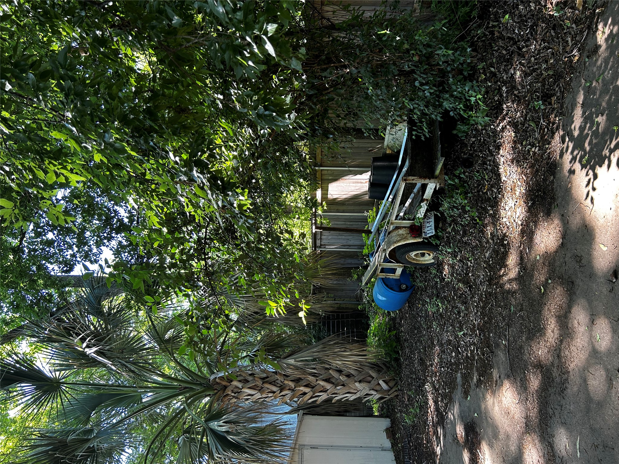 4511 B Avenue, Unit B Austin, TX 78751 - Photo 27 of 30 a backyard of a house with barbeque oven table and chairs