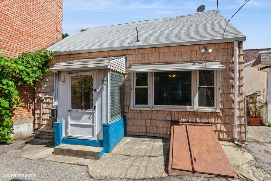 61-41 56th Road Queens, NY 11378 - Photo 1 of 1 a front view of a house with a porch