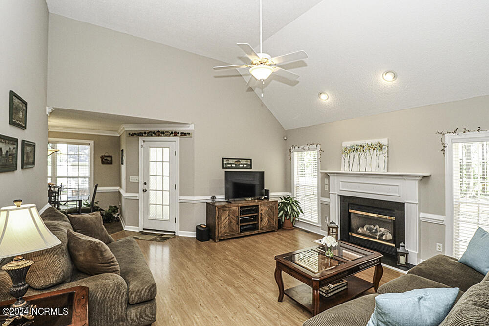3598 Carriage Farm Road Rocky Mount, NC 27804 - Photo 3 of 19 Vaulted ceiling w/ hardwood laminate flooring and fireplace!