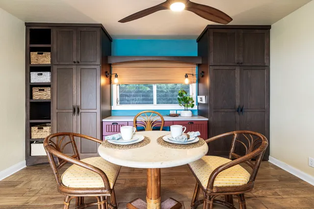 a dining room with furniture and window