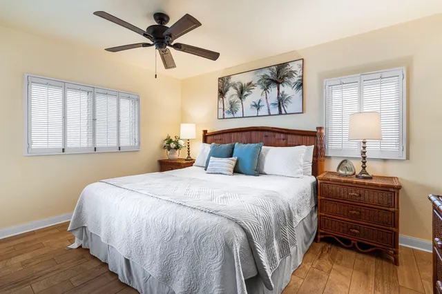 a bedroom with bed cabinet and window
